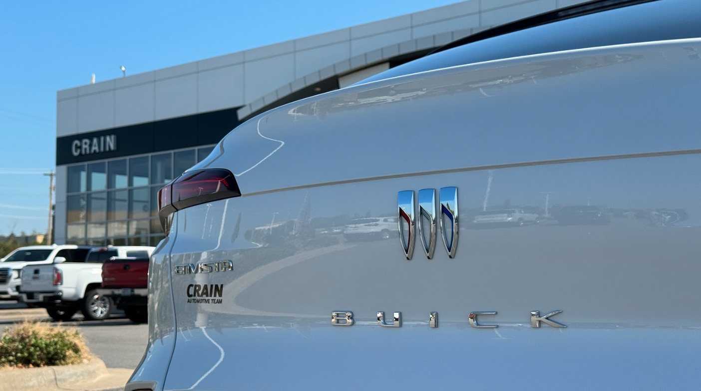Rear view of a silver Buick Envista parked at Crain Buick GMC in Conway